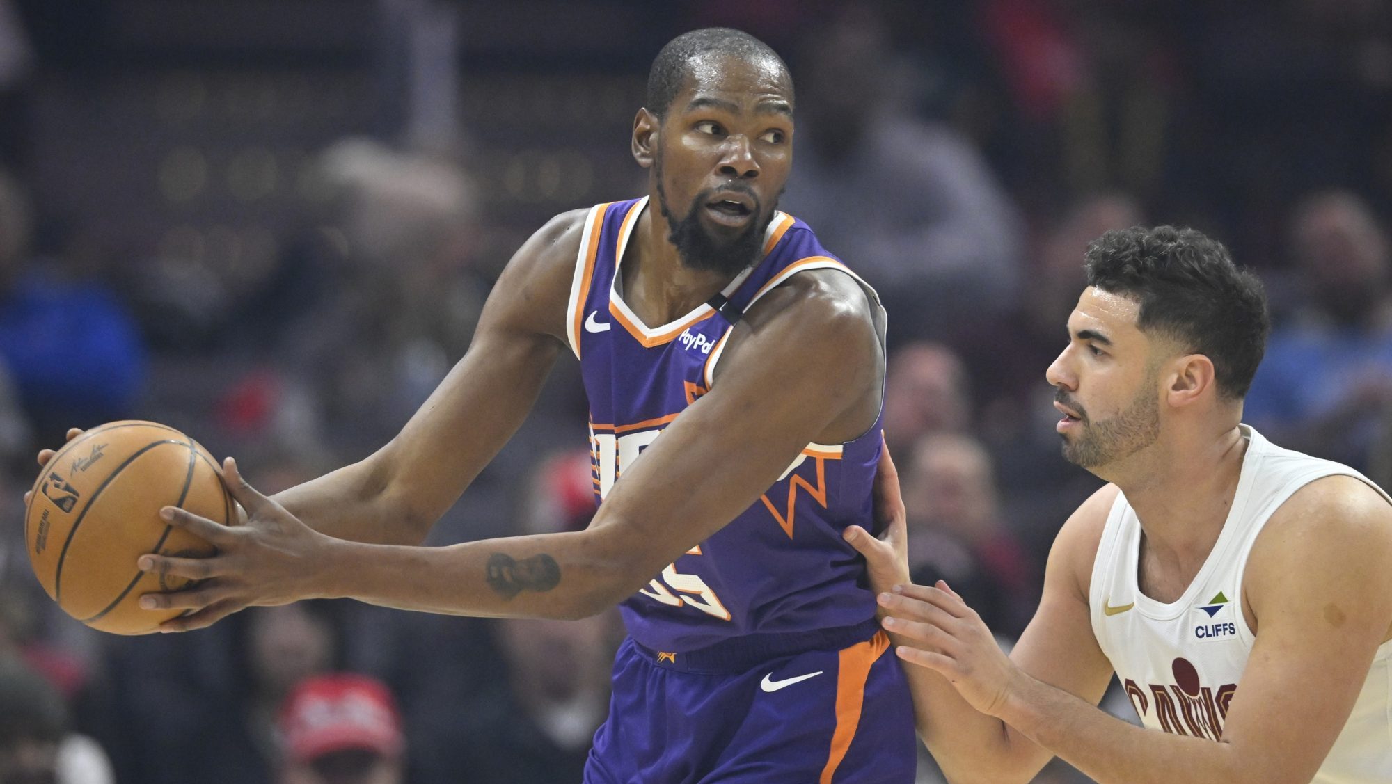 Jan 20, 2025; Cleveland, Ohio, USA; Cleveland Cavaliers forward Georges Niang (20) defends Phoenix Suns forward Kevin Durant (35) in the first quarter at Rocket Mortgage FieldHouse.