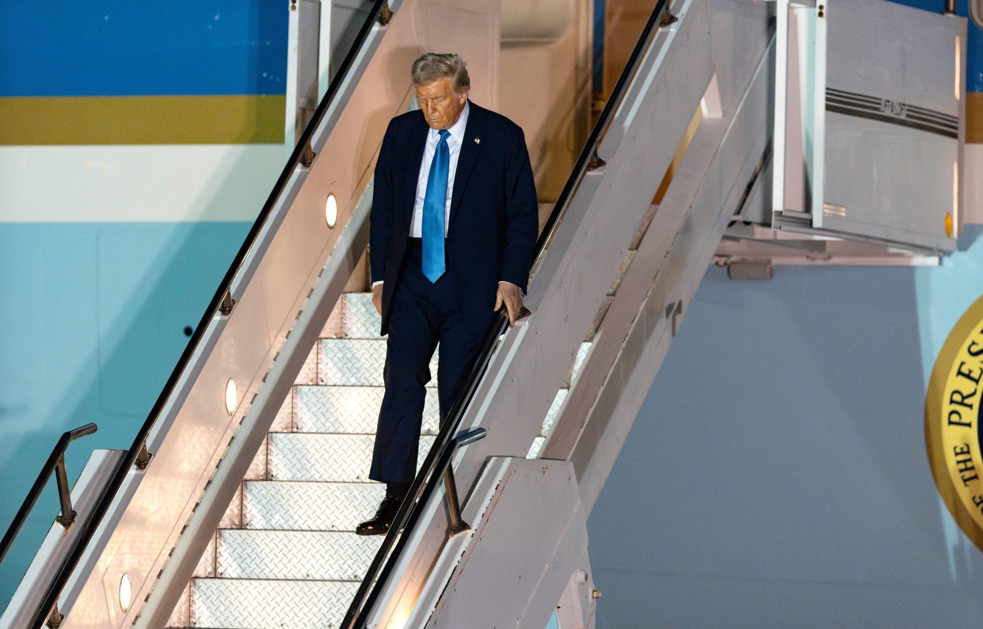 President Donald Trump arrives on Air Force One at Palm Beach International Airport in West Palm Beach, Florida on January 31, 2025. Trump is making his first trip home to Mar-a-Lago in Palm Beach since being sworn in as the 47th president of the United States.