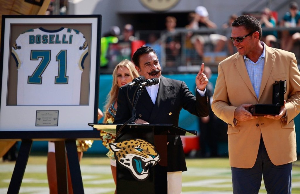 Hall of fame football tackle Tony Boselli looks to Jaguars owner Shad Khan while he was honored at halftime, while his family watched, with his Jacksonville Jaguars number 71 retired. Boselli was enshrined in Canton, Ohio this past August after his seven-season career all with the Jaguars. Sunday, Oct. 9, 2022 at TIAA Bank Field in Jacksonville. The honor took place between the Jacksonville Jaguars and the Houston Texans regular season game. The Texans won 13-6. The Texans won 13-6. [Corey Perrine/Florida Times-Union] Jki 100822 Texans Jags Cp 101