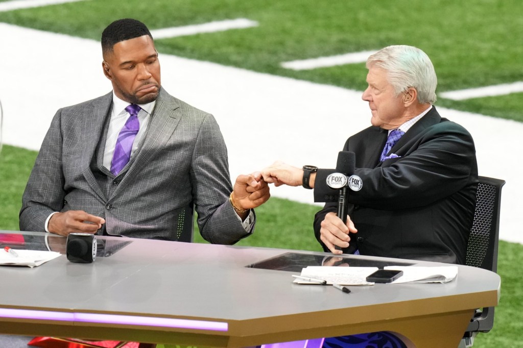 Feb 9, 2025; New Orleans, LA, USA; Fox Sports NFL Sunday analyst Michael Strahan (left) and Fox Sports NFL Sunday analyst Jimmie Johnson (right) react before Super Bowl LIX at Caesars Superdome.