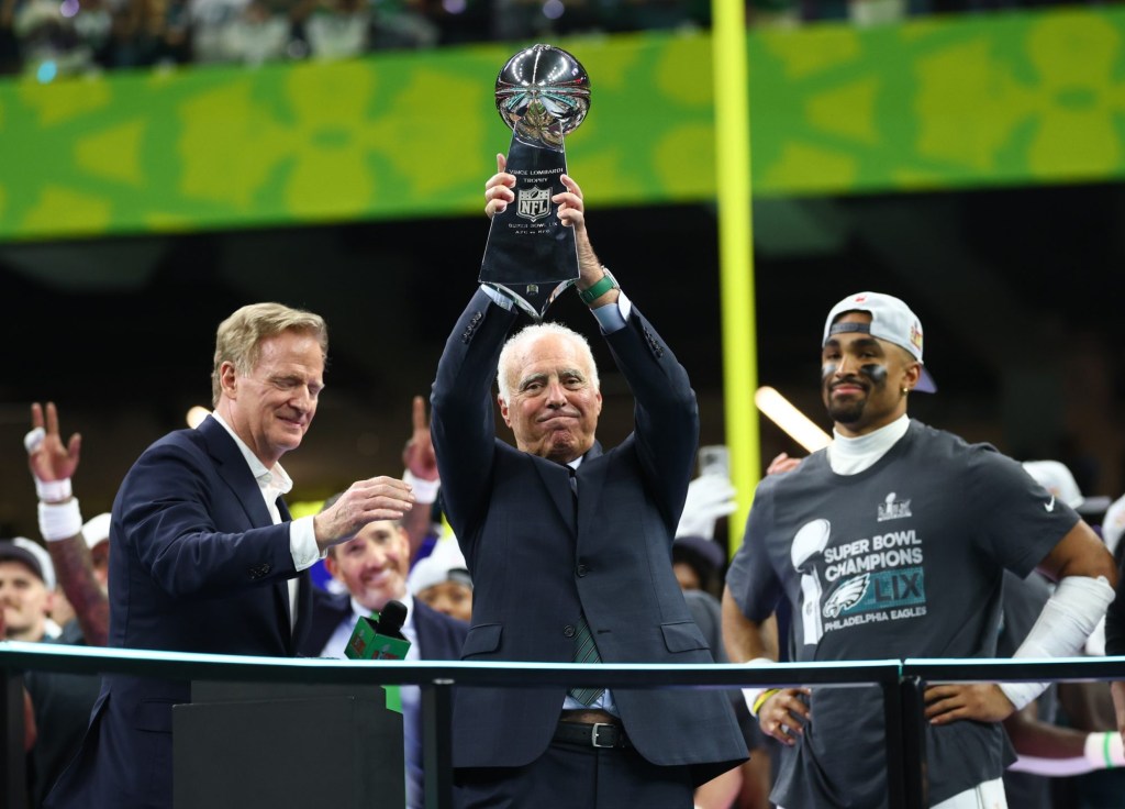 Feb 9, 2025; New Orleans, LA, USA; Philadelphia Eagles owner Jeffrey Lurie hoists the Vince Lombardi Trophy after defeating the Kansas City Chiefs in Super Bowl LIX at Ceasars Superdome.