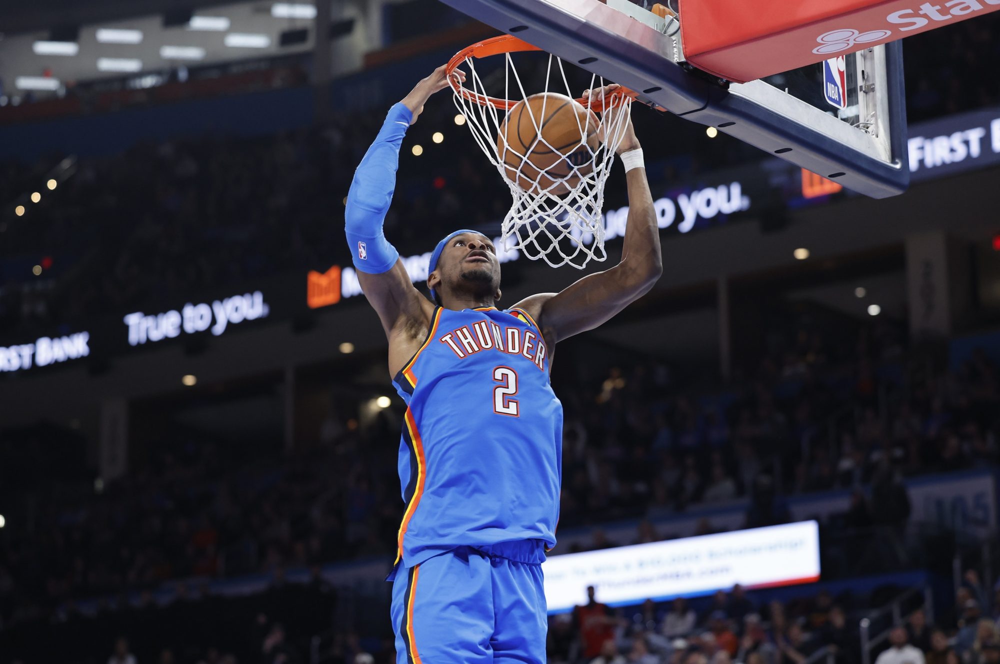 Feb 12, 2025; Oklahoma City, Oklahoma, USA; Oklahoma City Thunder guard Shai Gilgeous-Alexander (2) dunks against the Miami Heat during the second half at Paycom Center.