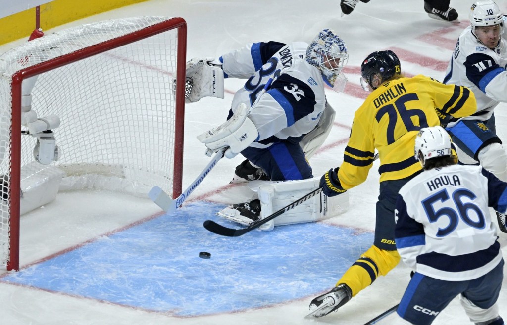 Feb 15, 2025; Montreal, Quebec, CAN; [Imagn Images direct customers only] Team Sweden defenseman Rasmus Dahlin (26) scores a goal against Team Finland goalie Kevin Lankinen (32) in the second period during a 4 Nations Face-Off ice hockey game at the Bell Centre