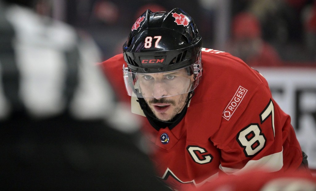 Feb 15, 2025; Montreal, Quebec, CAN; [Imagn Images direct customers only] Team Canada forward Sidney Crosby (87) prepares for a face-off against Team United States in the first period during a 4 Nations Face-Off ice hockey game at the Bell Centre. 