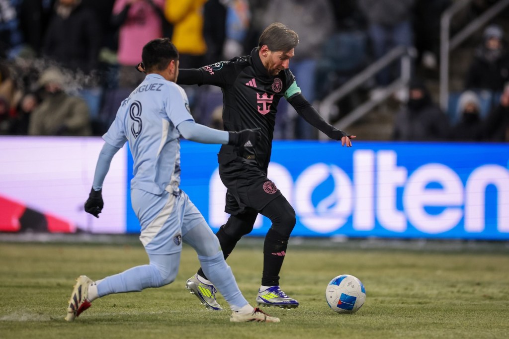 Feb 19, 2025; Kansas City, Kansas, USA; Inter Miami forward Lionel Messi (10) controls the ball around Sporting Kansas City midfielder Memo Rodriguez (8) during the first half at Children's Mercy Park.