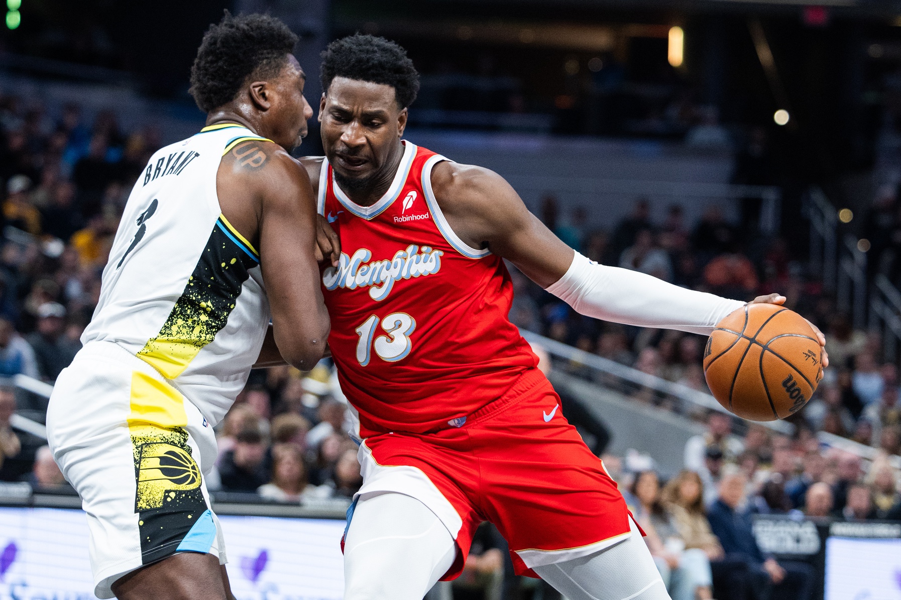 Feb 20, 2025; Indianapolis, Indiana, USA; Memphis Grizzlies forward Jaren Jackson Jr. (13) dribbles the ball while Indiana Pacers center Thomas Bryant (3) defends in the first half at Gainbridge Fieldhouse.