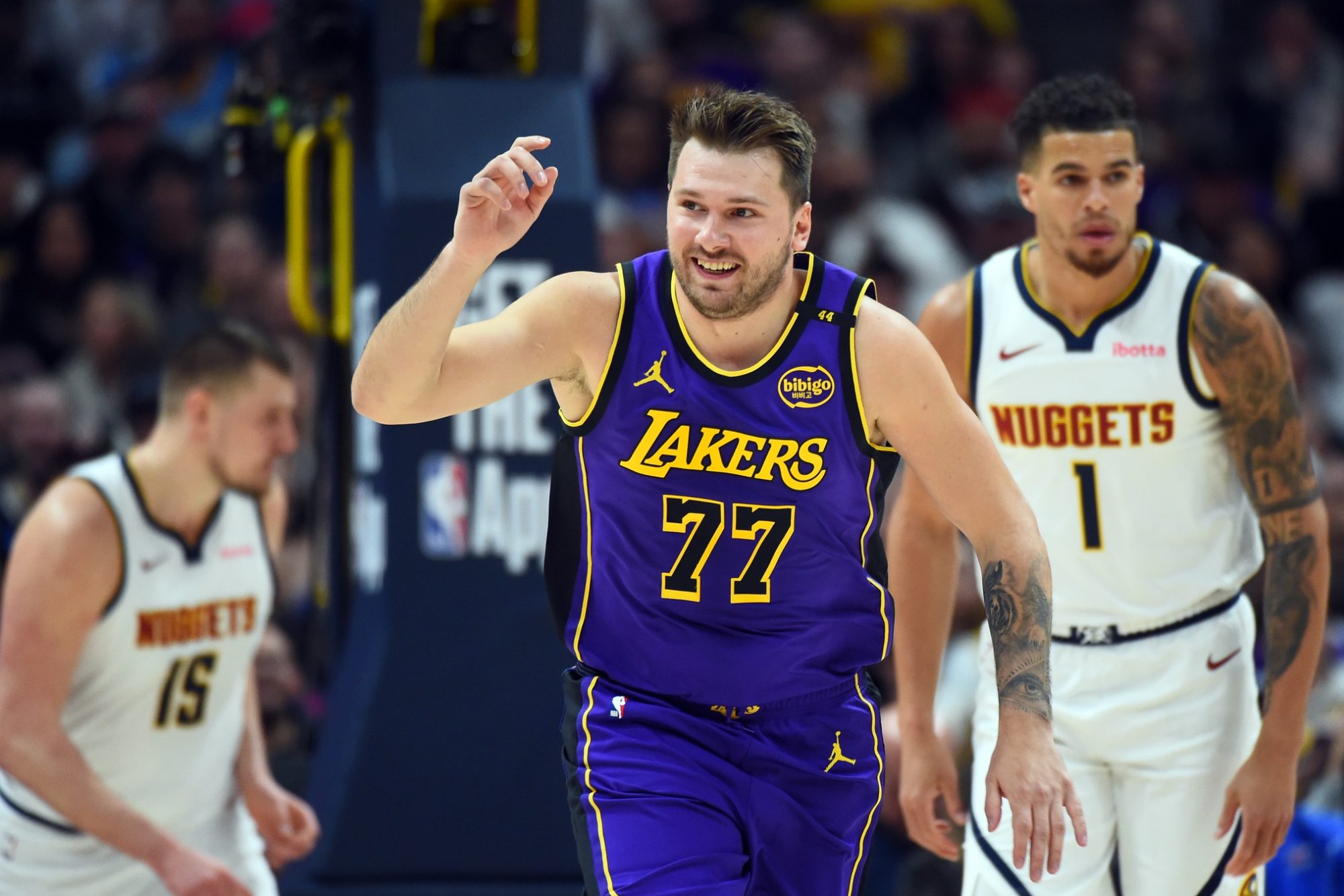 Feb 22, 2025; Denver, Colorado, USA; Los Angeles Lakers guard Luka Doncic (77) celebrates after a basket during the first half against the Denver Nuggets at Ball Arena.