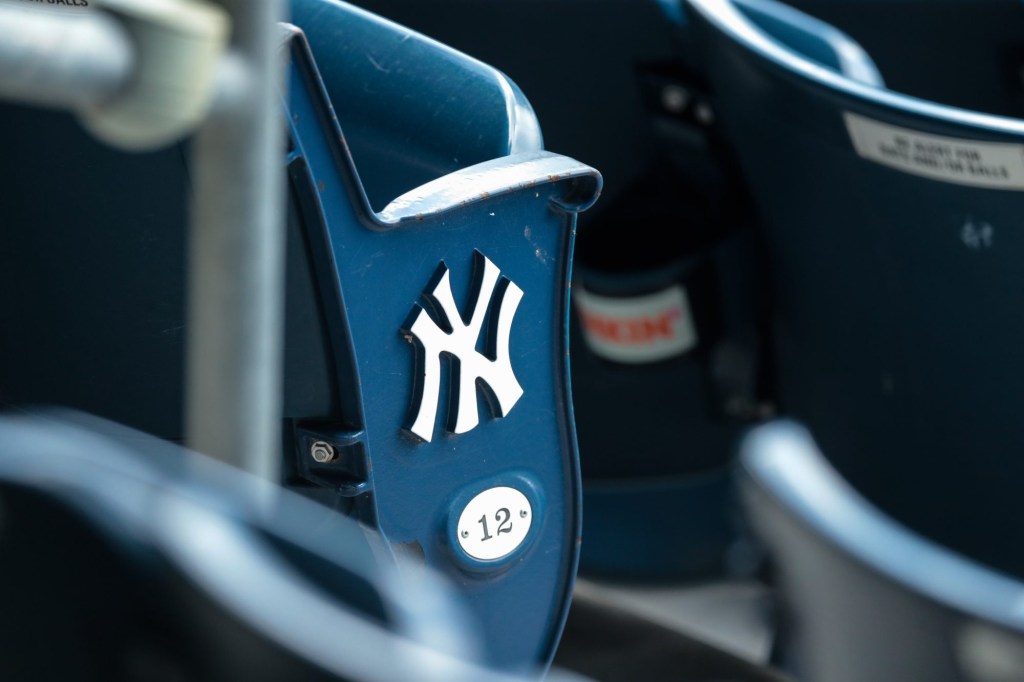 Jul 12, 2020; Bronx, New York, United States; A view of the New York Yankees logo and seat number of an empty seat during a simulated game during summer camp workouts at Yankee Stadium.