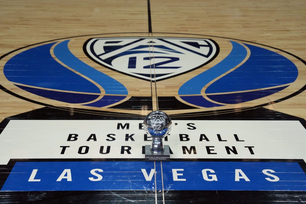 Mar 16, 2024; Las Vegas, NV, USA; The 2024 Pac-12 Conference men's basketball champion trophy at center court on the Pac-12 logo at T-Mobile Arena.