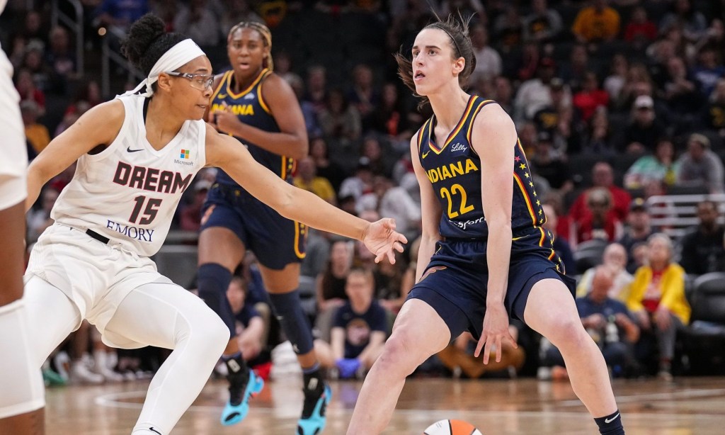 Indiana Fever guard Caitlin Clark (22) rushes up the court against Atlanta Dream guard Allisha Gray (15) on Thursday, May 9, 2024, during the preseason game against the Atlanta Dream at Gainbridge Fieldhouse in Indianapolis. The Indiana Fever defeated the Atlanta Dream, 83-80.