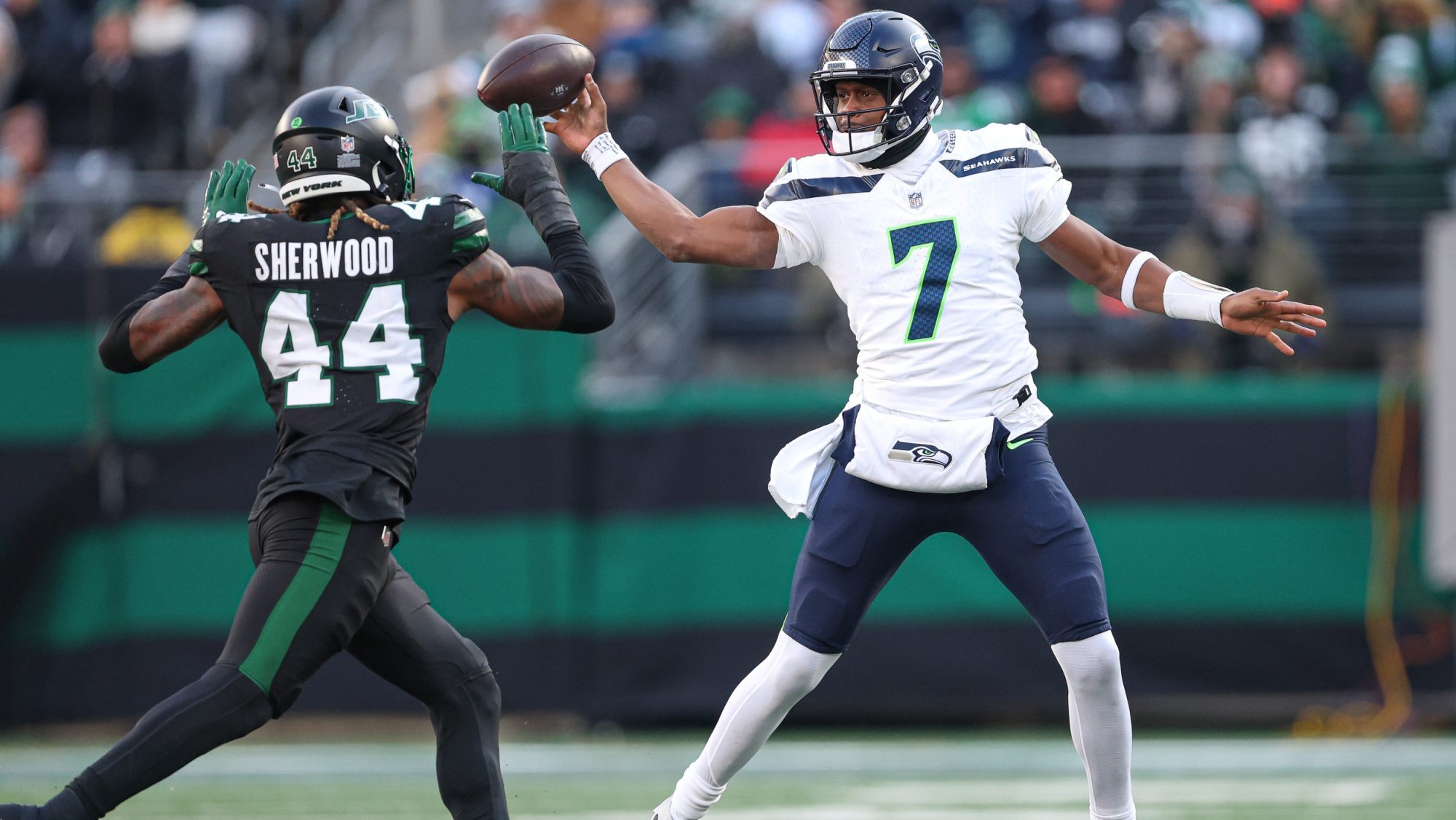 Dec 1, 2024; East Rutherford, New Jersey, USA; New York Jets linebacker Jamien Sherwood (44) knocks down a pass by Seattle Seahawks quarterback Geno Smith (7) during the first half at MetLife Stadium.