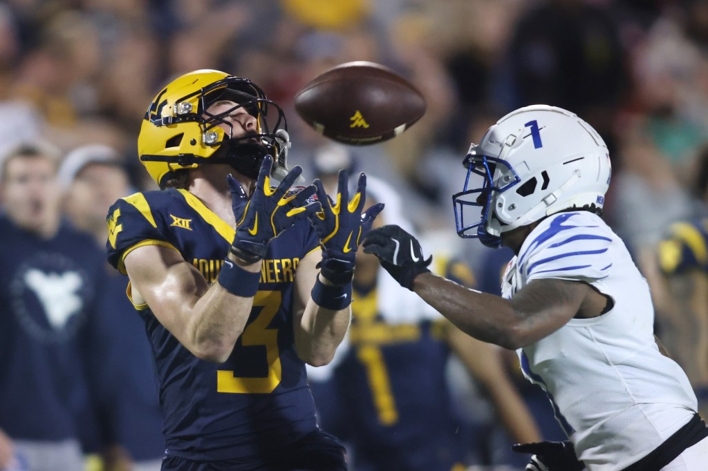 Dec 17, 2024; Frisco, TX, USA; West Virginia Mountaineers wide receiver Hudson Clement (3) catches a pass against Memphis Tigers defensive back Davion Ross (1) in the fourth quarter at Toyota Stadium.