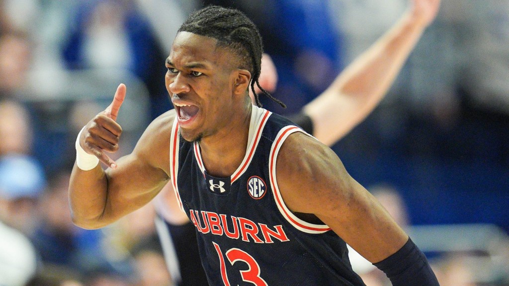 Auburn Tigers guard Miles Kelly (13) reacts after hitting a three-point shot against Kentucky during the first half in SEC basketball at Rupp Arena Saturday afternoon in Lexington, Kentucky March 1, 2025