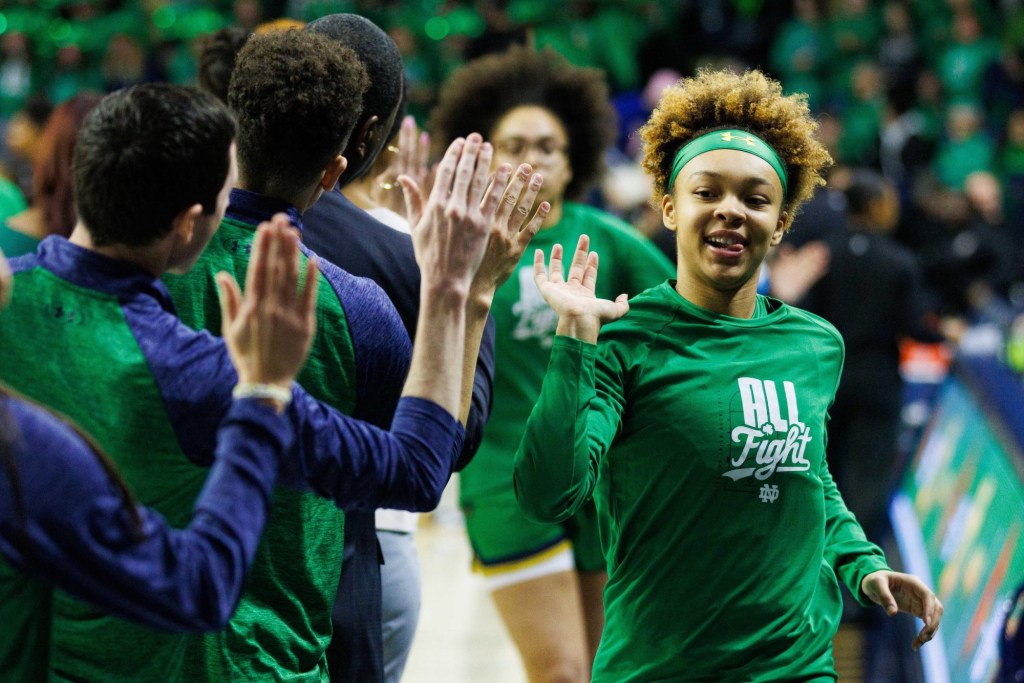 Notre Dame guard Hannah Hidalgo, right, high fives staff before a NCAA women's basketball game between No. 3 Notre Dame and No. 25 Louisville at Purcell Pavilion on Sunday, March 2, 2025, in South Bend.