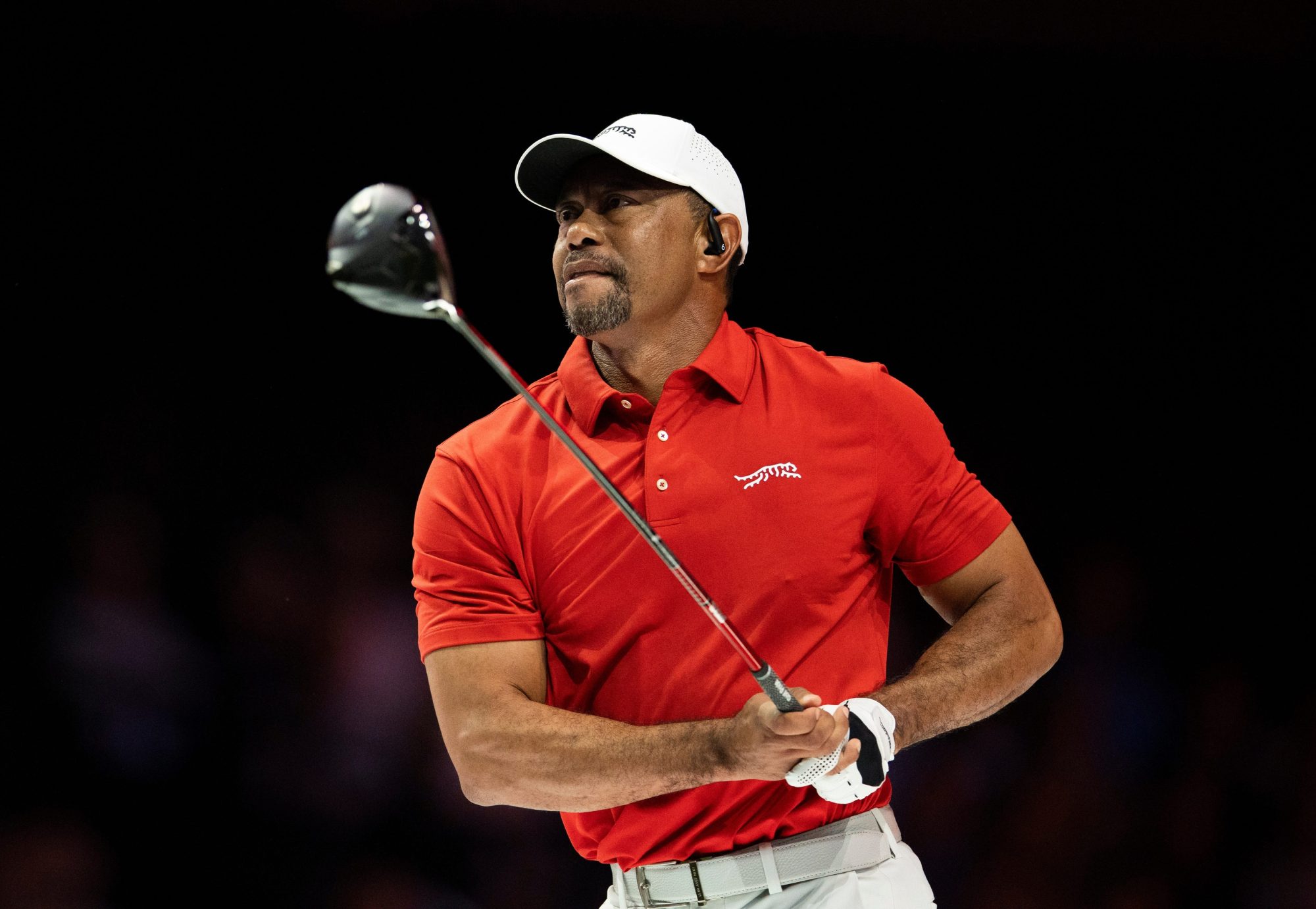 Tiger Woods of Jupiter Links GC tees off during their TGL match against Atlanta Drive GC at SoFi Center on March 4, 2025, in Palm Beach Gardens, Florida.