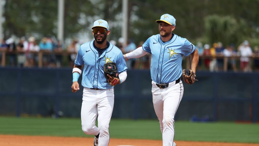 Mar 9, 2025; Port Charlotte, Florida, USA; Tampa Bay Rays second base Richie Palacios (1) and Tampa Bay Rays second base Brandon Lowe (8) run back to the dugout at the end of the inning against the Toronto Blue Jays at Charlotte Sports Park.