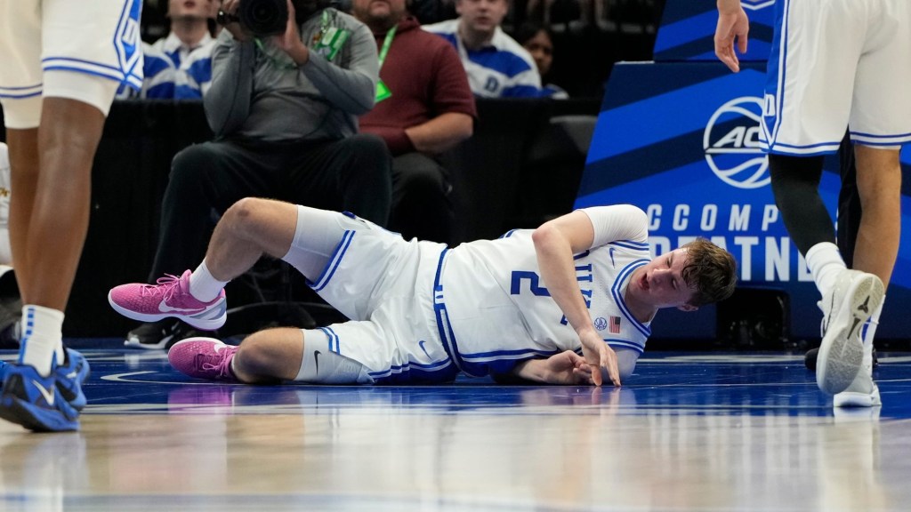 Mar 13, 2025; Charlotte, NC, USA; Duke Blue Devils forward Cooper Flagg (2) is injured in the first half at Spectrum Center.