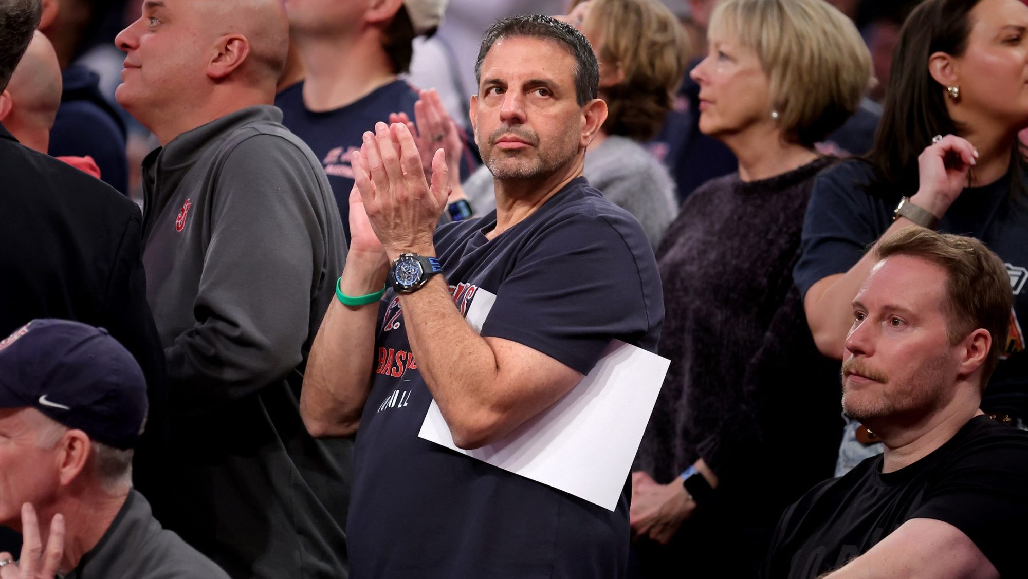 Mar 13, 2025; New York, NY, USA; American businessman and St. John's donor Mike Repole stands and applauds during the second half against the Butler Bulldogs at Madison Square Garden.