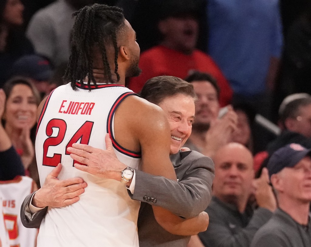 Mar 15, 2025; New York, NY, USA; St. John's Red Storm forward Zuby Ejiofor (24) gets a hug from St. John's Red Storm head coach Rick Pitino as the game ends against the Creighton Bluejays at Madison Square Garden