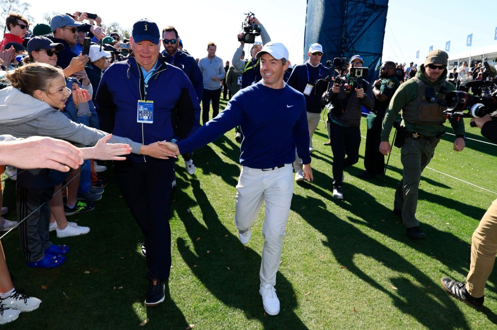 Rory McIlroy is congratulated by a fan as he heads to the clubhouse after a three-hole aggregate playoff of The Players Championship PGA golf tournment Monday, March 17, 2025 at TPC Sawgrass in Ponte Vedra Beach, Fla. Rory McIlroy won his second Players Championship winning +1 to J.J. Spaun’s +3 tiebreaking playoff round.