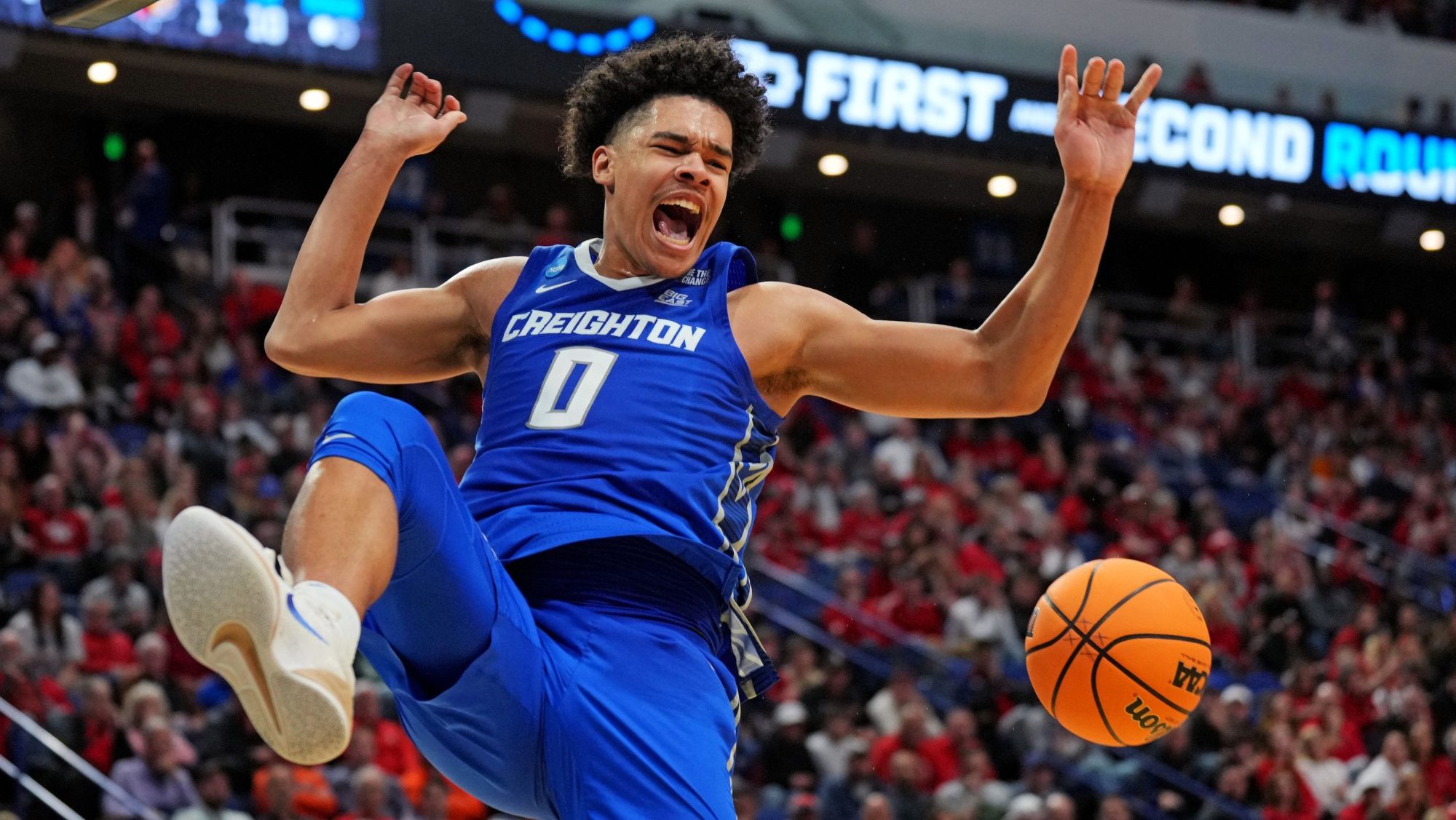 Mar 20, 2025; Lexington, KY, USA; Creighton Bluejays forward Jasen Green (0) dunks the ball during the second half against the Louisville Cardinals in the first round of the NCAA Tournament at Rupp Arena