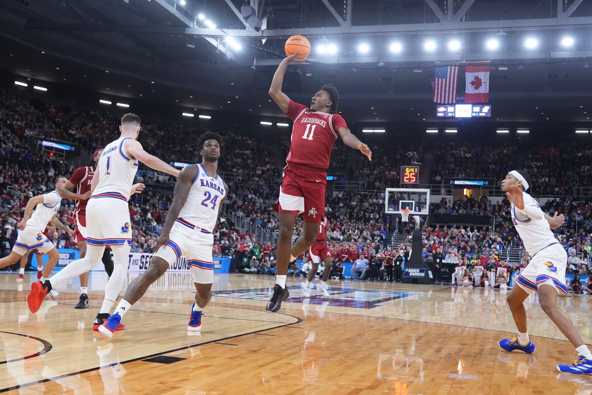 Mar 20, 2025; Providence, RI, USA; Arkansas Razorbacks forward Karter Knox (11) controls the ball against Kansas Jayhawks during the first half at Amica Mutual Pavilion.