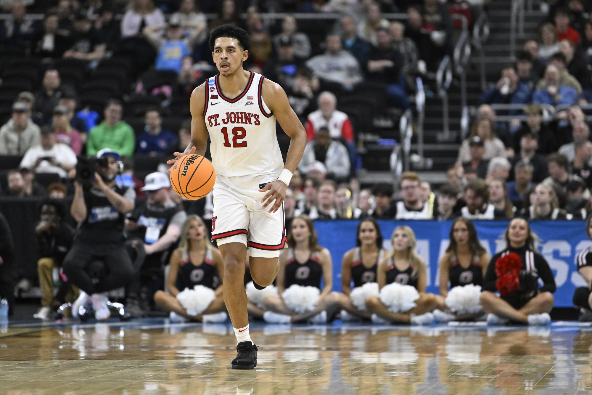 Mar 20, 2025; Providence, RI, USA; St. John's Red Storm guard RJ Luis Jr. (12) dribbles the ball during the second half against the Omaha Mavericks at Amica Mutual Pavilion.
