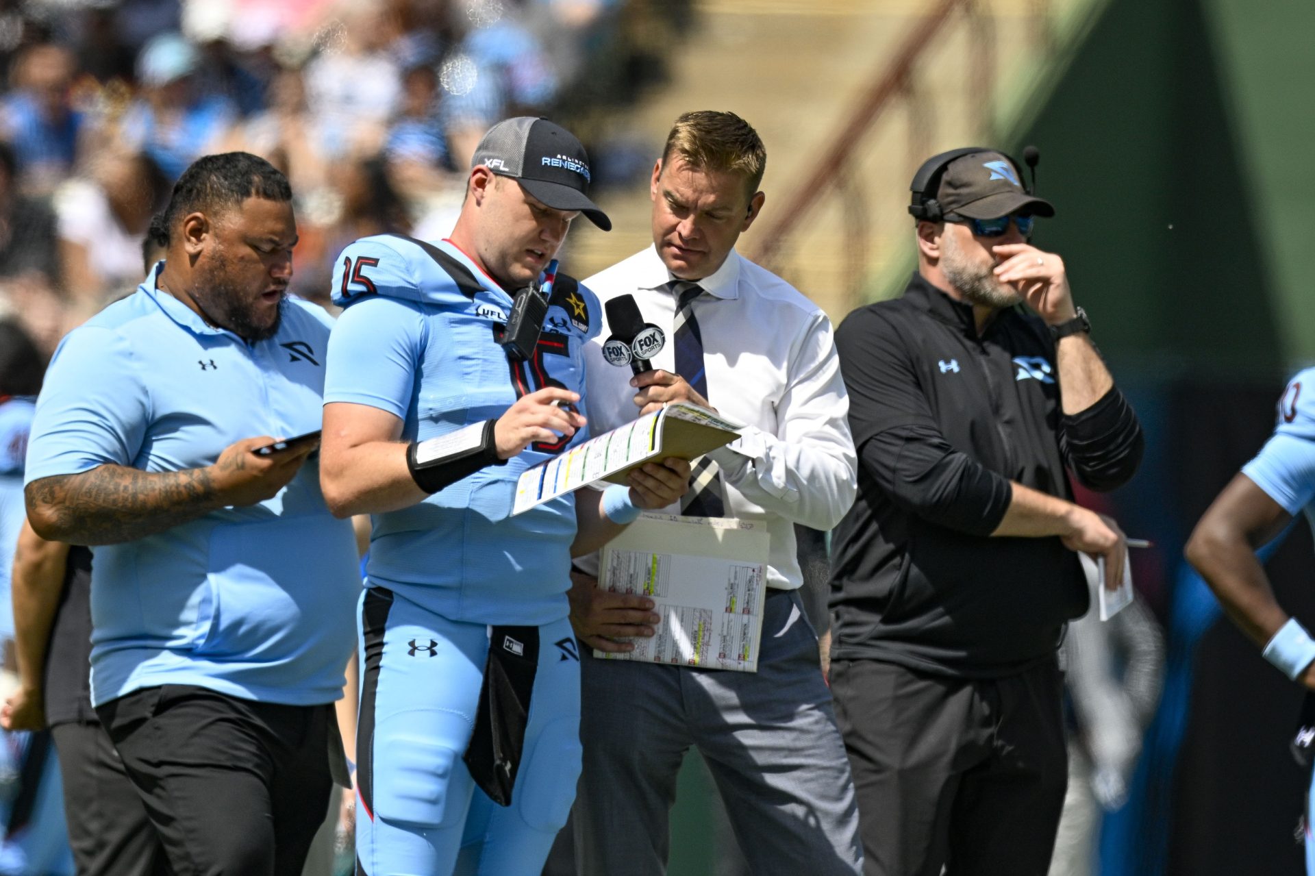 Mar 30, 2024; Arlington, TX, USA; Fox sports sideline reporter and former NFL quarterback Brock Huard talks on the sidelines with Arlington Renegades quarterback Holton Ahlers (15) during the second half of the game against the Birmingham Stallions at Choctaw Stadium.