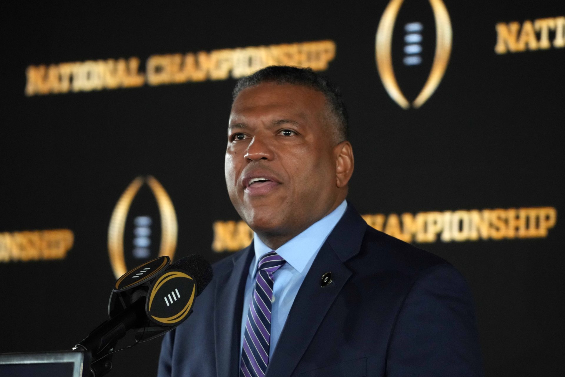 Jan 21, 2025; Atlanta, GA, USA; College Football Playoff executive director Rich Clark speaks during the CFP National Championship Host Committee handoff press conference at The Westin Peachtree Plaza, Savannah Ballroom.