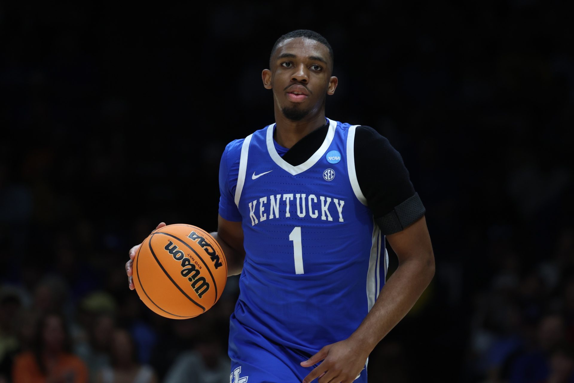 Mar 28, 2025; Indianapolis, IN, USA; Kentucky Wildcats guard Lamont Butler (1) dribbles the ball against the Tennessee Volunteers in the first half during a Midwest Regional semifinal of the 2025 NCAA tournament at Lucas Oil Stadium.