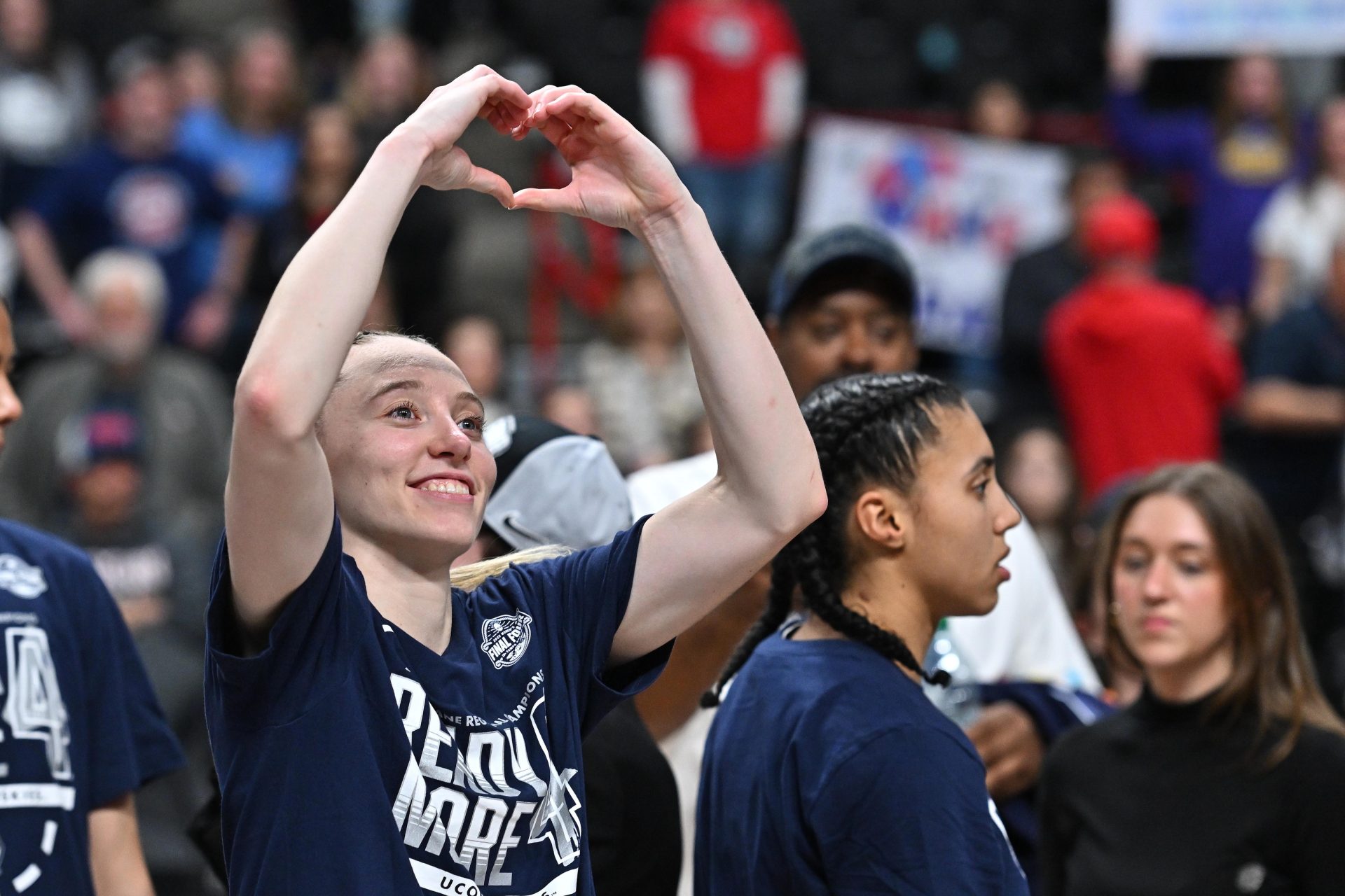 Mar 31, 2025; Spokane, WA, USA; UConn Huskies guard Paige Bueckers (5) makes a heart symbol to the crowd after a Elite 8 NCAA Tournament basketball game against the USC Trojans at Spokane Arena.