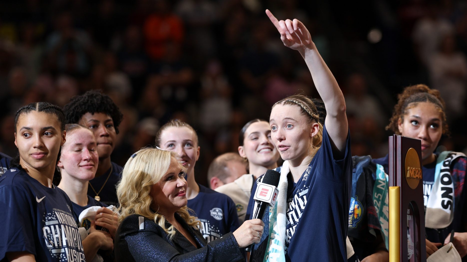 Apr 6, 2025; Tampa, FL, USA; Connecticut Huskies guard Paige Bueckers (5) is interviewed by ESPN reporter Holly Rowe after the national championship of the women's 2025 NCAA tournament against the South Carolina Gamecocks at Amalie Arena.