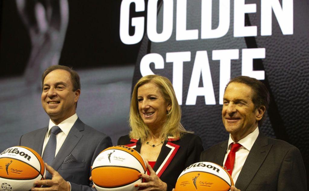 Oct 5, 2023; San Francisco, CA, USA; Golden State Warriors co-executive director & chief executive officer Joe Lacob, WNBA commissioner Cathy Engelbert and Warriors co-executive director Peter Guber pose for a group photo during a press conference to announce an expansion WNBA franchise in the San Francisco Bay Area at Chase Center.