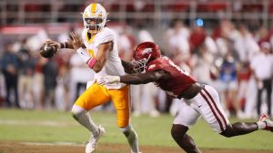 Oct 5, 2024; Fayetteville, Arkansas, USA; Tennessee Volunteers quarte rback Nico Iamaleava (8) scrambles out of the pocket in the second quarter against the Arkansas Razorbacks at Donald W. Reynolds Razorback Stadium.