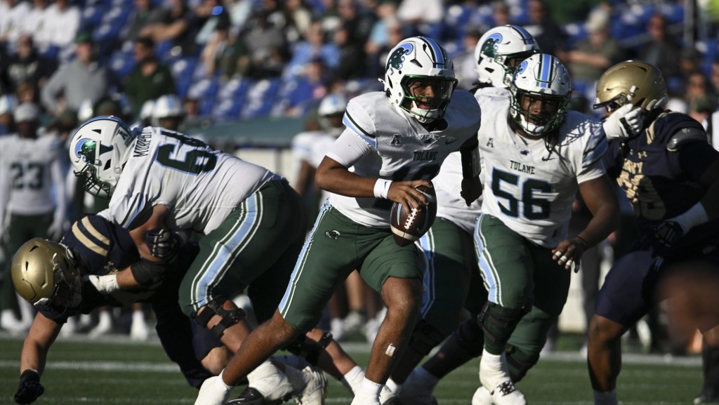 Nov 16, 2024; Annapolis, Maryland, USA; Tulane Green Wave quarterback Darian Mensah (10) rushes during the second half against the Navy Midshipmen at Navy-Marine Corps Memorial Stadium.