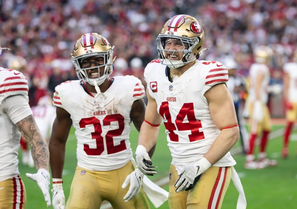 Jan 5, 2025; Glendale, Arizona, USA; San Francisco 49ers running back Patrick Taylor Jr. (32) and fullback Kyle Juszczyk (44) celebrate a touchdown against the Arizona Cardinals at State Farm Stadium.