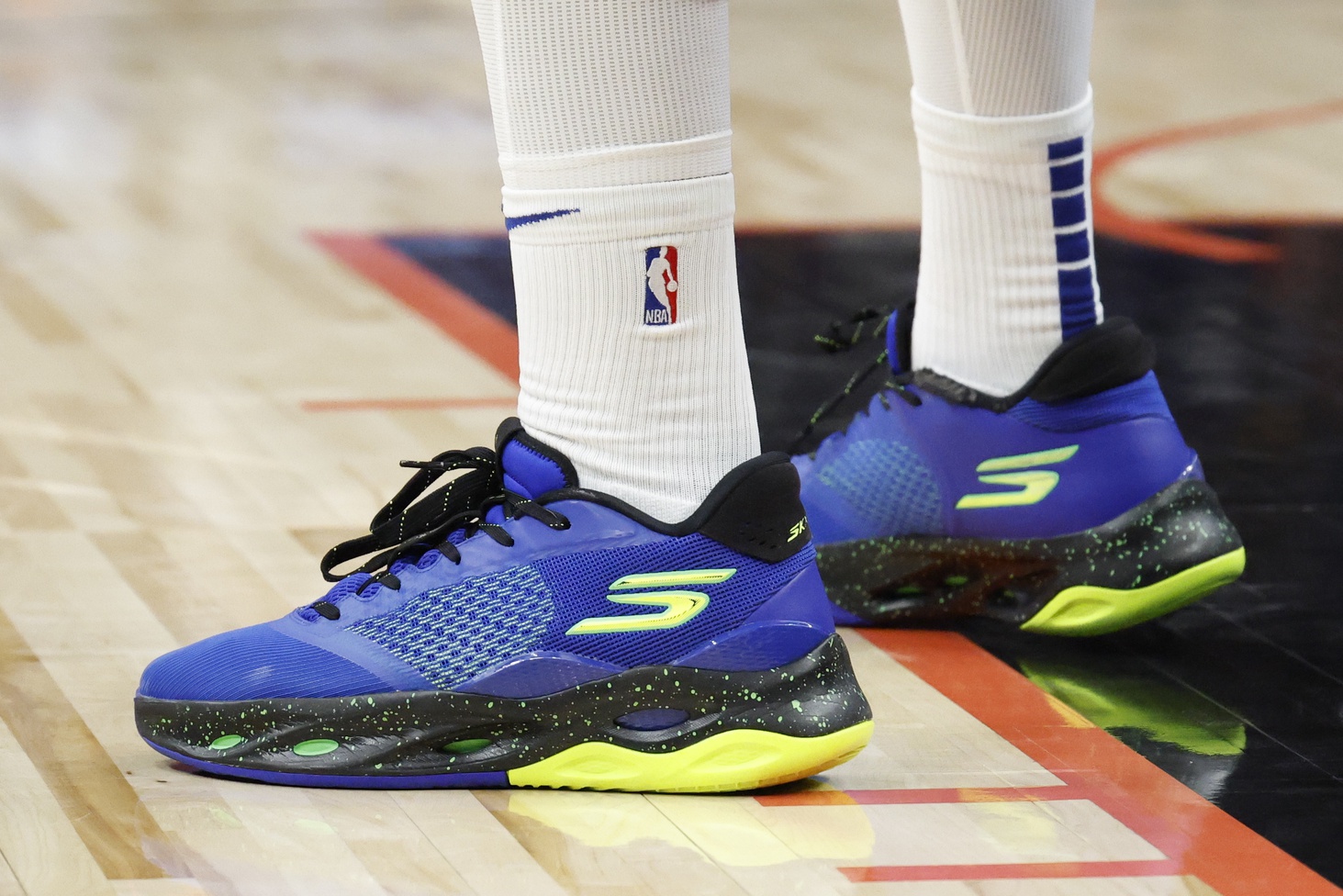 Feb 7, 2025; Detroit, Michigan, USA; A detailed view of the shoes worn by Philadelphia 76ers center Joel Embiid (21) in the second half against the Detroit Red Wings at Little Caesars Arena.