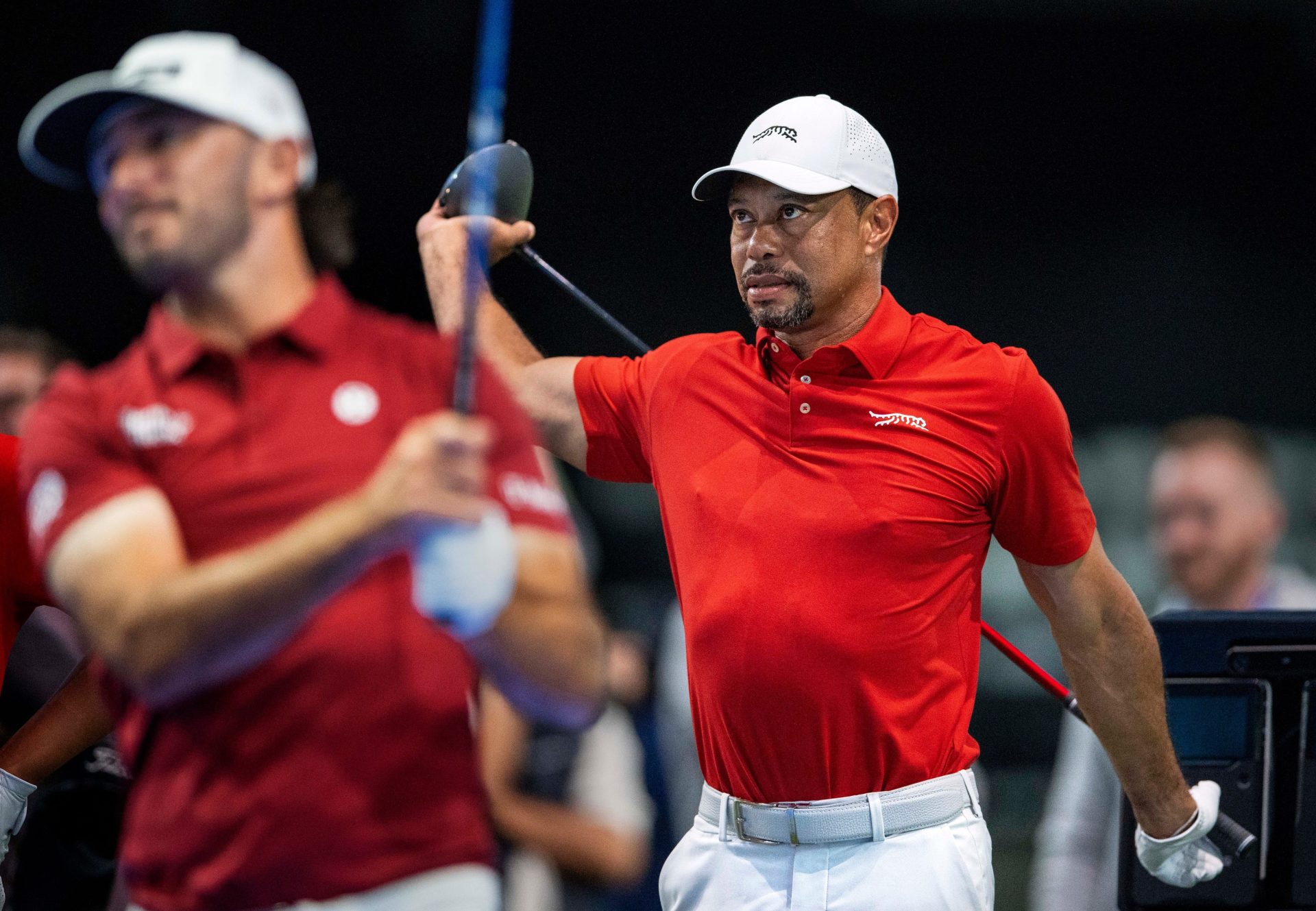 Tiger Woods of Jupiter Links GC stretches during warm ups for TGL golf match against Atlanta Drive GC at SoFi Center on March 4, 2025, in Palm Beach Gardens, Florida.
