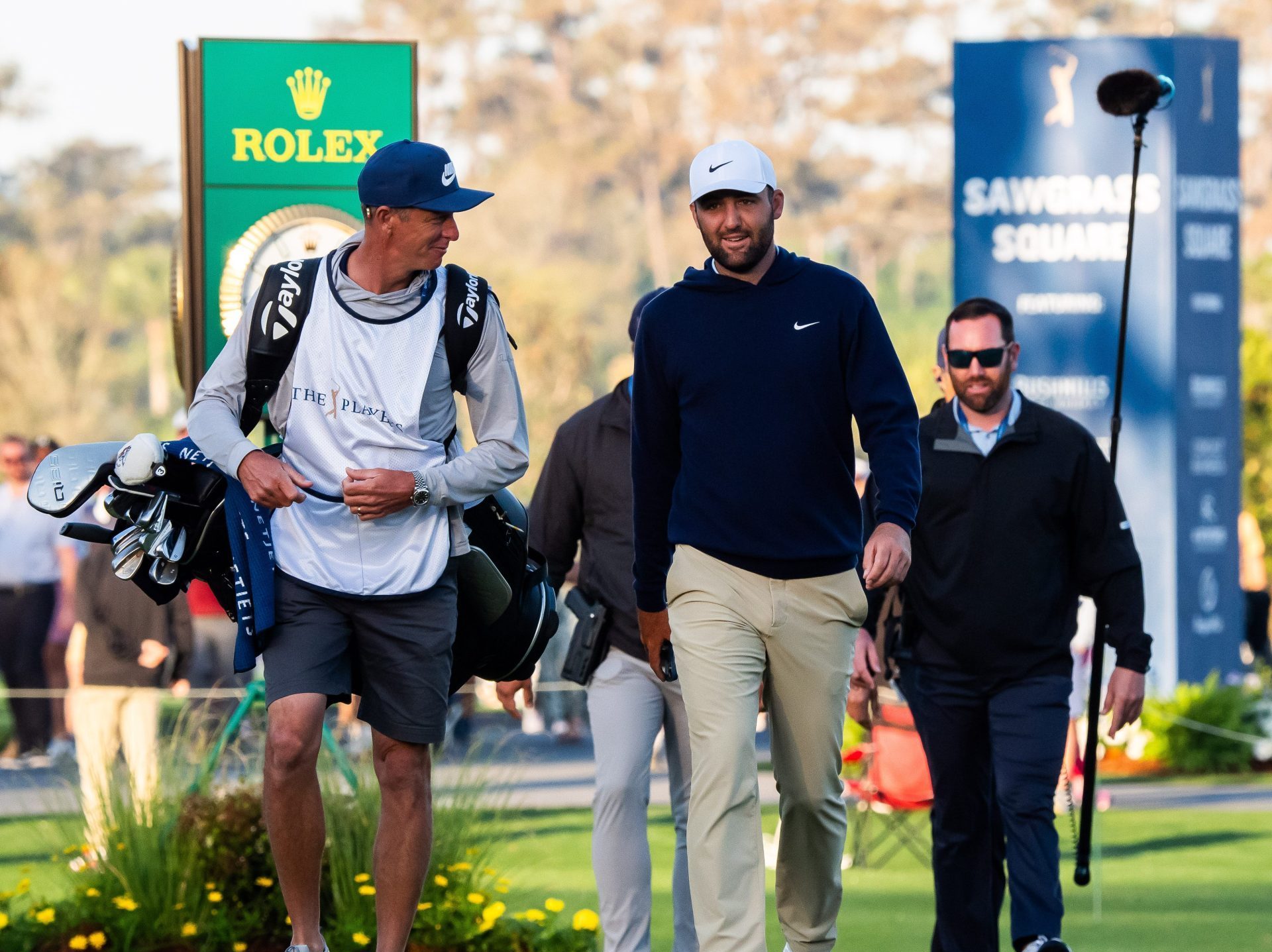 Caddy Ted Scott talks with Scottie Scheffler during the second round of the Players Championship at TPC Sawgrass in Ponte Vedra Beach, Fl. Friday March 14, 2025.