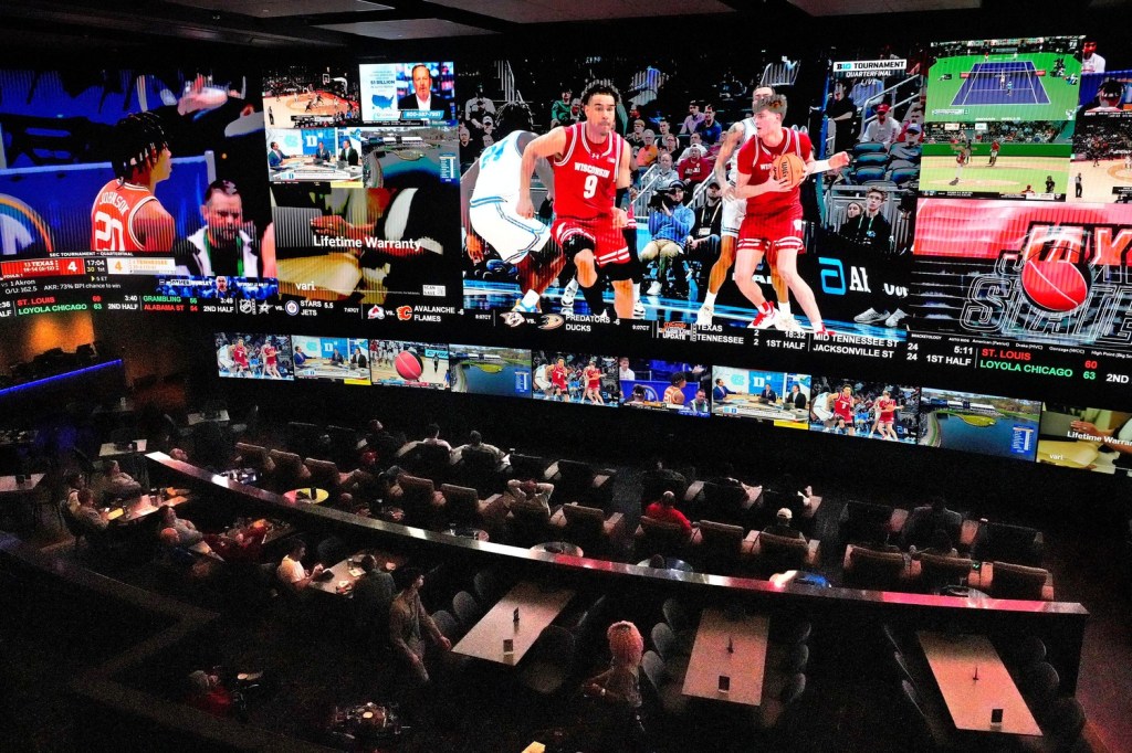 Potawatomi Sportsbook patrons watch the University of Wisconsin men play UCLA on Friday, March 14, 2025. The venue is open for the first time during March Madness and is expecting to be busy over the next few weeks in Milwaukee. Angela Peterson/Milwaukee Journal Sentinel