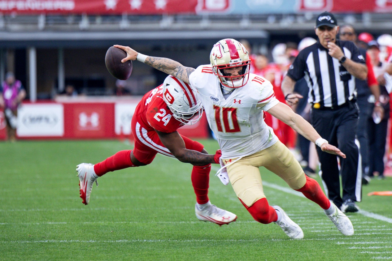 Mar 30, 2025; Washington, D.C., USA; Birmingham Stallions quarterback Alex McGough (10) runs the ball as DC Defenders cornerback Kiondre Thomas (24) defends in the second half at Audi Field.