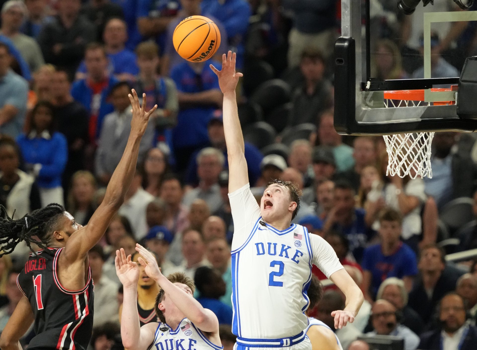 Apr 5, 2025; San Antonio, TX, USA; Duke Blue Devils forward Cooper Flagg (2) and Houston Cougars forward Joseph Tugler (11) battle for the ball in the semifinals of the men's Final Four of the 2025 NCAA Tournament at the Alamodome.