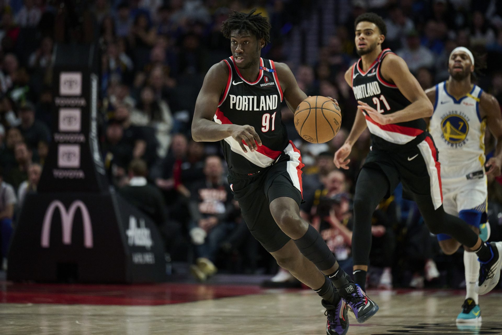 Apr 11, 2025; Portland, Oregon, USA; Portland Trail Blazers guard Sidy Cissoko (91) dribbles the basketball during the second half against the Golden State Warriors at Moda Center.