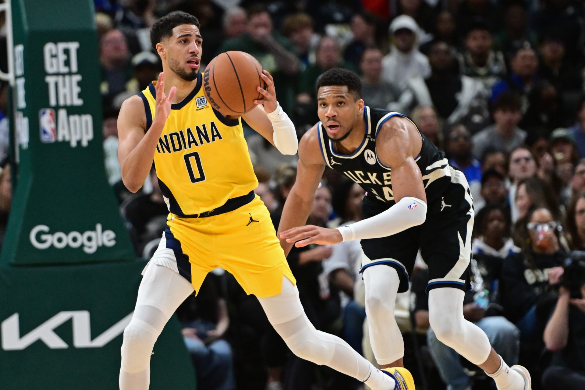 Apr 27, 2025; Milwaukee, Wisconsin, USA; Indiana Pacers guard Tyrese Haliburton (0) looks for a shot against Milwaukee Bucks forward Giannis Antetokounmpo (34) in the third quarter during game four of first round for the 2024 NBA Playoffs at Fiserv Forum.
