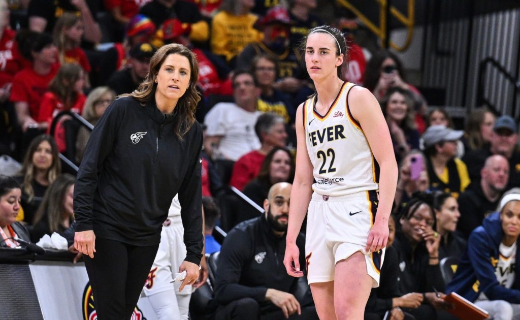 May 4, 2025; Iowa City, IA, USA; Indiana Fever guard Caitlin Clark (22) looks on with head coach Stephanie White during the third quarter against the Brazil National Team at Carver-Haweye Arena.