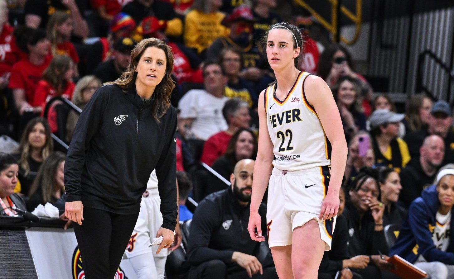 May 4, 2025; Iowa City, IA, USA; Indiana Fever guard Caitlin Clark (22) looks on with head coach Stephanie White during the third quarter against the Brazil National Team at Carver-Haweye Arena.