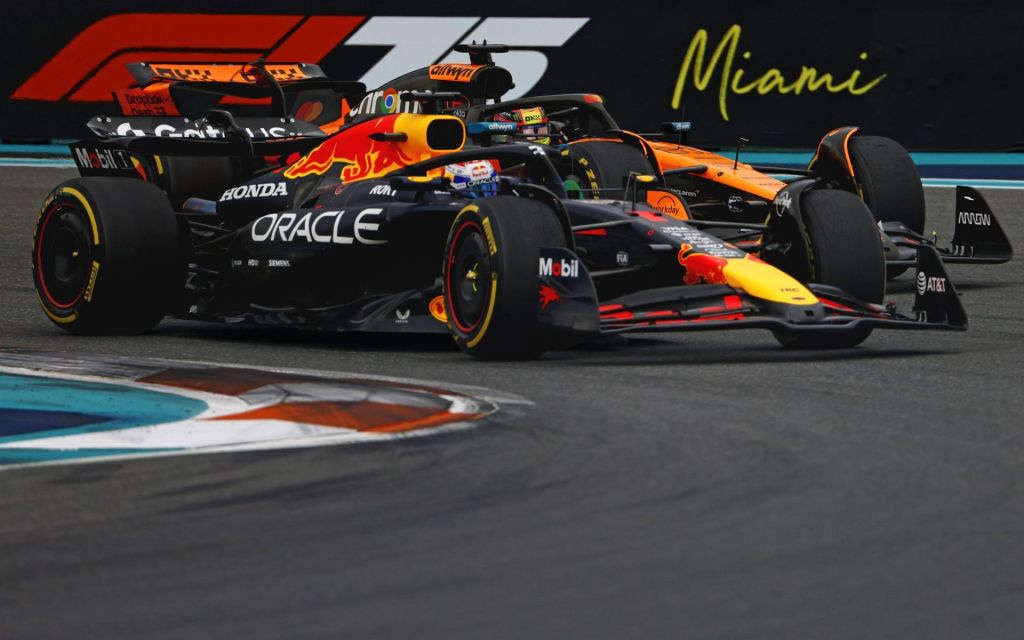 May 4, 2025; Miami Gardens, FL, USA; Red Bull driver Max Verstappen (1) and McLaren driver Oscar Piastri (81) during the F1 Miami Grand Prix at Miami International Autodrome.