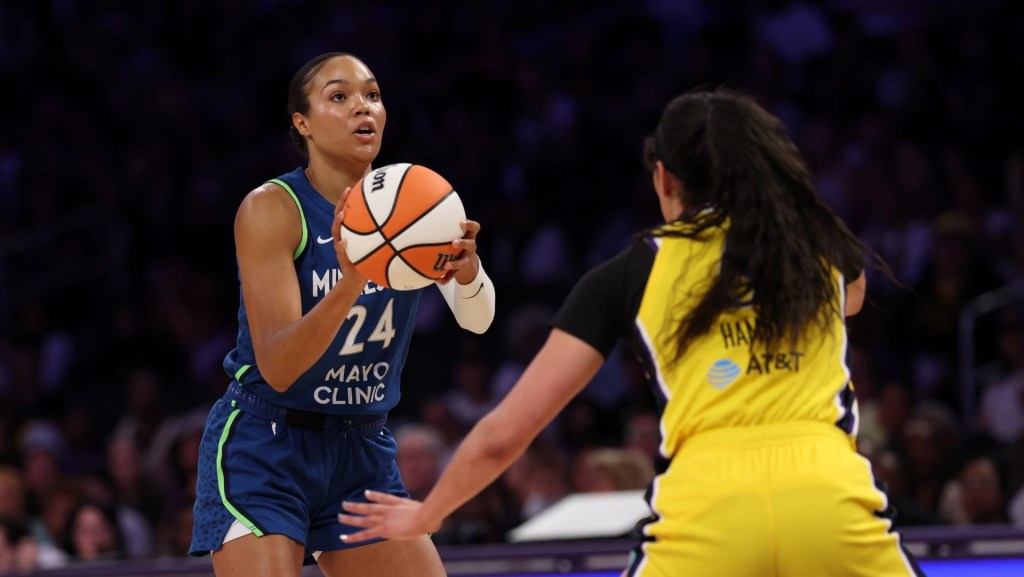 May 18, 2025; Los Angeles, California, USA; Minnesota Lynx forward Napheesa Collier (24) looks to shoot against Los Angeles Sparks forward Dearica Hamby (5) during the first quarter at Crypto.com Arena.