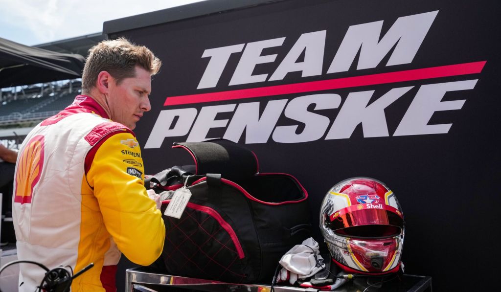 Team Penske driver Josef Newgarden (2) takes off his helmet Monday, May 19, 2025, after practice for the 109th running of the Indianapolis 500 at Indianapolis Motor Speedway.
