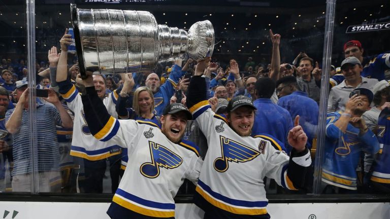 Jun 12, 2019; Boston, MA, USA; St. Louis Blues center Ivan Barbashev (49) and right wing Vladimir Tarasenko (91) hoists the Stanley Cup after defeating the Boston Bruins in game seven of the 2019 Stanley Cup Final at TD Garden